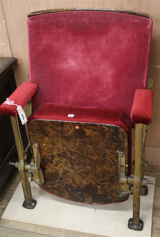A vintage folding cinema seat
